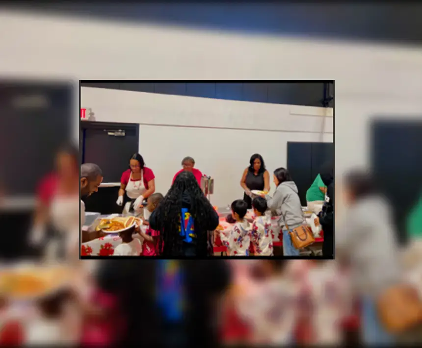 A group of people sitting around a table.